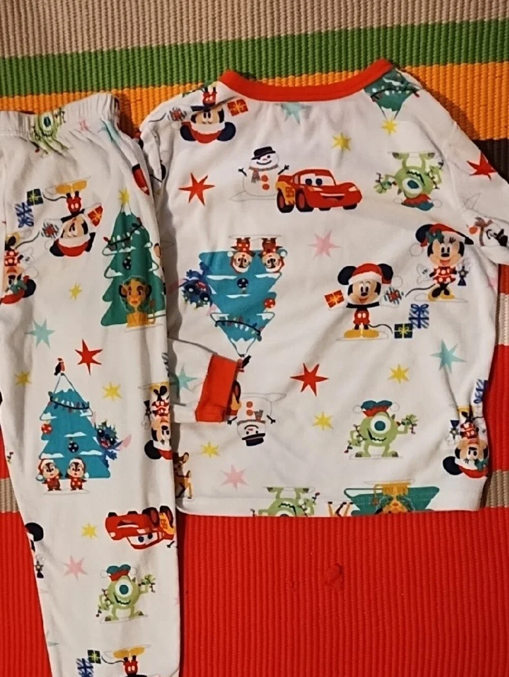 Disney Kids Holiday Pajama Set - White with Red Accents and Multicolor Prints.